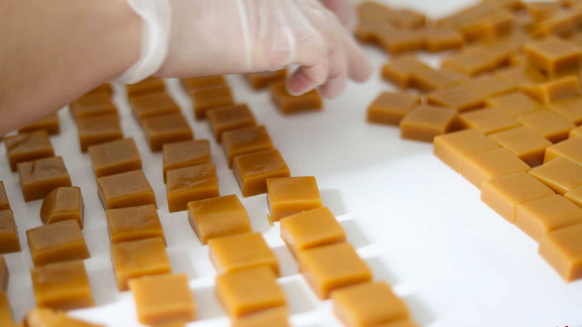 Hand-cut caramels being arranged and checked in the Frankenmuth kitchen